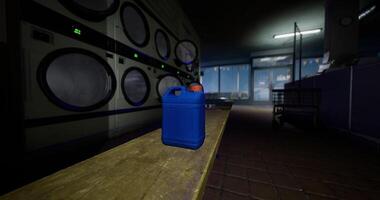 CGI Blue container placed on a table in a dimly lit laundromat setting video