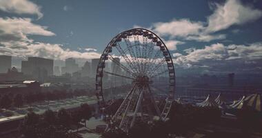 CGI City skyline with a large ferris wheel under a cloudy sky during sunset video