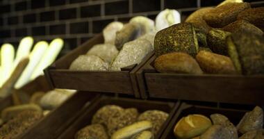 CGI Fresh artisan bread displayed on wooden racks in a bakery setting video
