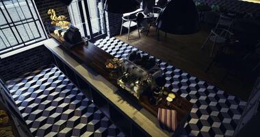 CGI Modern cafe interior with geometric flooring and espresso machine setup video