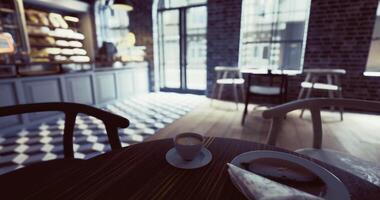 CGI Cozy cafe setting with a coffee cup and a pastry in a bright space video