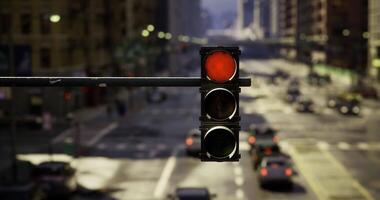 CGI Traffic light displaying red in a busy downtown area during daylight hours video