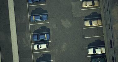 CGI Birds eye view of a busy parking lot with various parked cars during daylight video