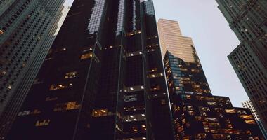 CGI Skyscrapers reflecting evening light in a bustling urban environment video