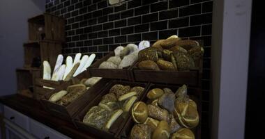 CGI Artisan breads displayed in rustic wooden crates at a bakery video