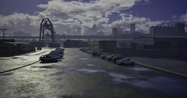 CGI Industrial area with parked cars and cloudy skyline during twilight video