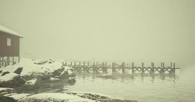 CGI Snowy dock on a misty lake surrounded by winter landscape video