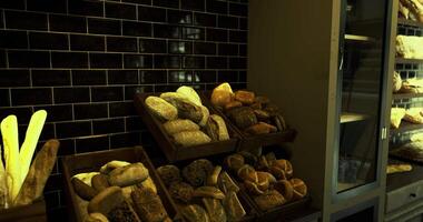CGI Assortment of fresh artisan breads displayed in a cozy bakery setting video