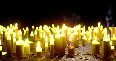 CGI Flickering candlelight illuminates a dark space with warm tones video