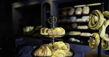 CGI Croissants and pretzels displayed in a bakery during early morning hours video