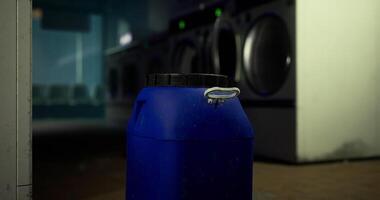 CGI Lid on blue container in a laundromat during late evening hours video