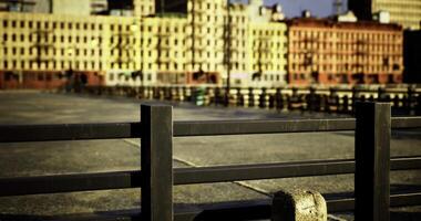 CGI Colorful buildings overlook a waterfront promenade during sunny daytime video