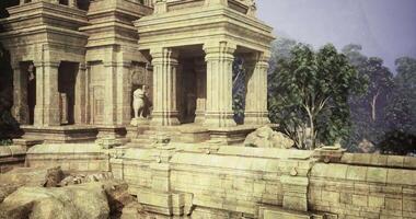 CGI An ancient temple complex is nestled among verdant trees and rocks video