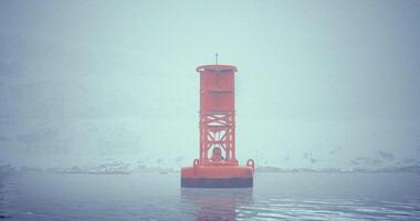 CGI Bright orange buoy stands out in a foggy waterfront setting near a shoreline video