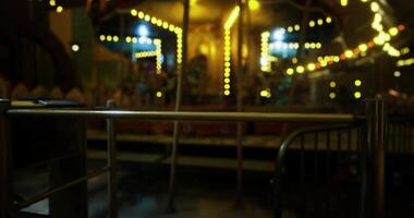 CGI Evening at the amusement park with illuminated carousel and festive lights video