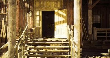 CGI Old wooden building with open door and sunlight shining on steps video