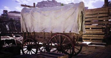 CGI Historic wooden wagon covered with cloth in an old western setting video