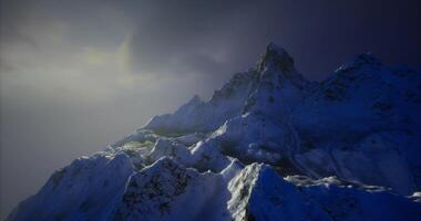 CGI Stunning mountain range illuminated by soft sunset glow in winter video