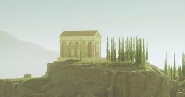 CGI Ancient temple stands on cliff surrounded by mountains and trees during dusk video