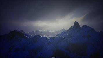 CGI Majestic mountains under a twilight sky with dramatic lighting effects video