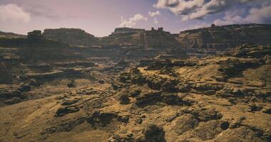 CGI Grand rocky landscape with rugged terrain under bright sky during daytime video