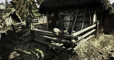 CGI Rustic wooden cabin in a forested area during daytime with a weathered fence video