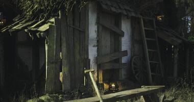 CGI Rustic wooden cabin under warm glow of lanterns at twilight video
