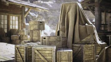 CGI Mysterious covered object atop wooden crates in a rustic setting video