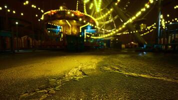 CGI Carnival night with illuminated attractions and a wet ground video