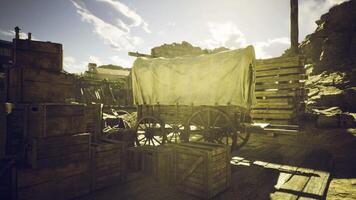CGI Western landscape featuring an old wagon and wooden crates in sunlight video