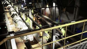 CGI Industrial robots operate in a modern manufacturing facility during nighttime video