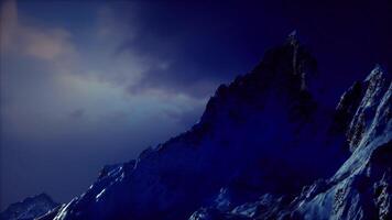 CGI Majestic mountain peak under a twilight sky with dramatic lighting video