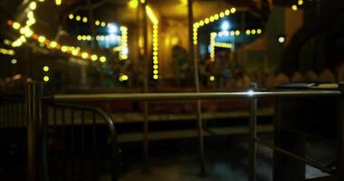 CGI Brightly lit carousel at an amusement park during late evening hours video