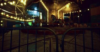 CGI Nighttime view of an illuminated carousel at a deserted amusement park video