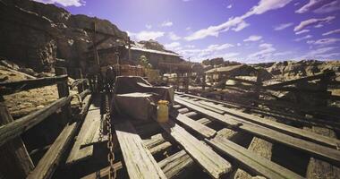 CGI Old wooden dock with crates and barrels under a bright blue sky video