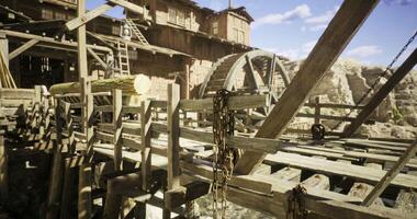 CGI Rustic wooden bridge leads to an old water mill in a desert landscape video