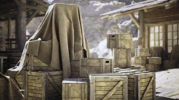 CGI Wooden crates covered with a cloth in a rustic outdoor setting video