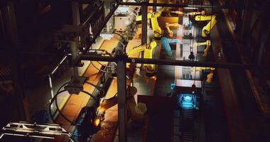 CGI Exploring automated robotics in a modern manufacturing facility at night video