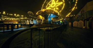 CGI Lively carnival atmosphere with bright lights and attractions at night video