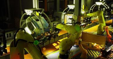 CGI Industrial robots assembling components in a modern automated factory video