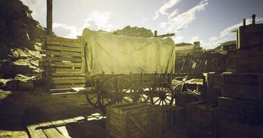 CGI Wagon and crates in a dusty settlement during golden hour video