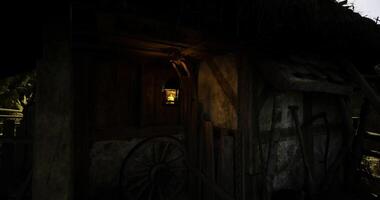CGI Rustic wooden cabin illuminated by lantern at night in a serene environment video