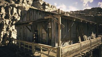 CGI Rustic wooden structure nestled among rocky cliffs in a desert landscape video