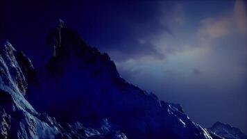 CGI Mountain peak silhouetted against twilight sky with dramatic lighting effects video