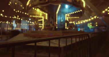 CGI Brightly lit carousel at an amusement park during nighttime festivities video