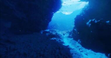 CGI Underwater grotto with sunlight streaming through rocky crevices video