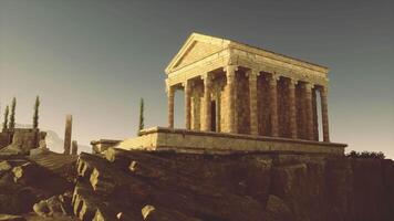 CGI Ancient temple on rocky hillside under clear sky at sunset video