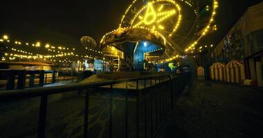 CGI Festive night at the amusement park with illuminated rides and attractions video