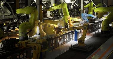 CGI Advanced robotic arms assemble components in a high tech manufacturing facility video