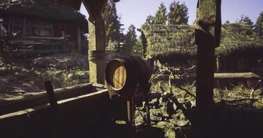 CGI Rustic wooden barrel next to village structure in a serene outdoor setting video